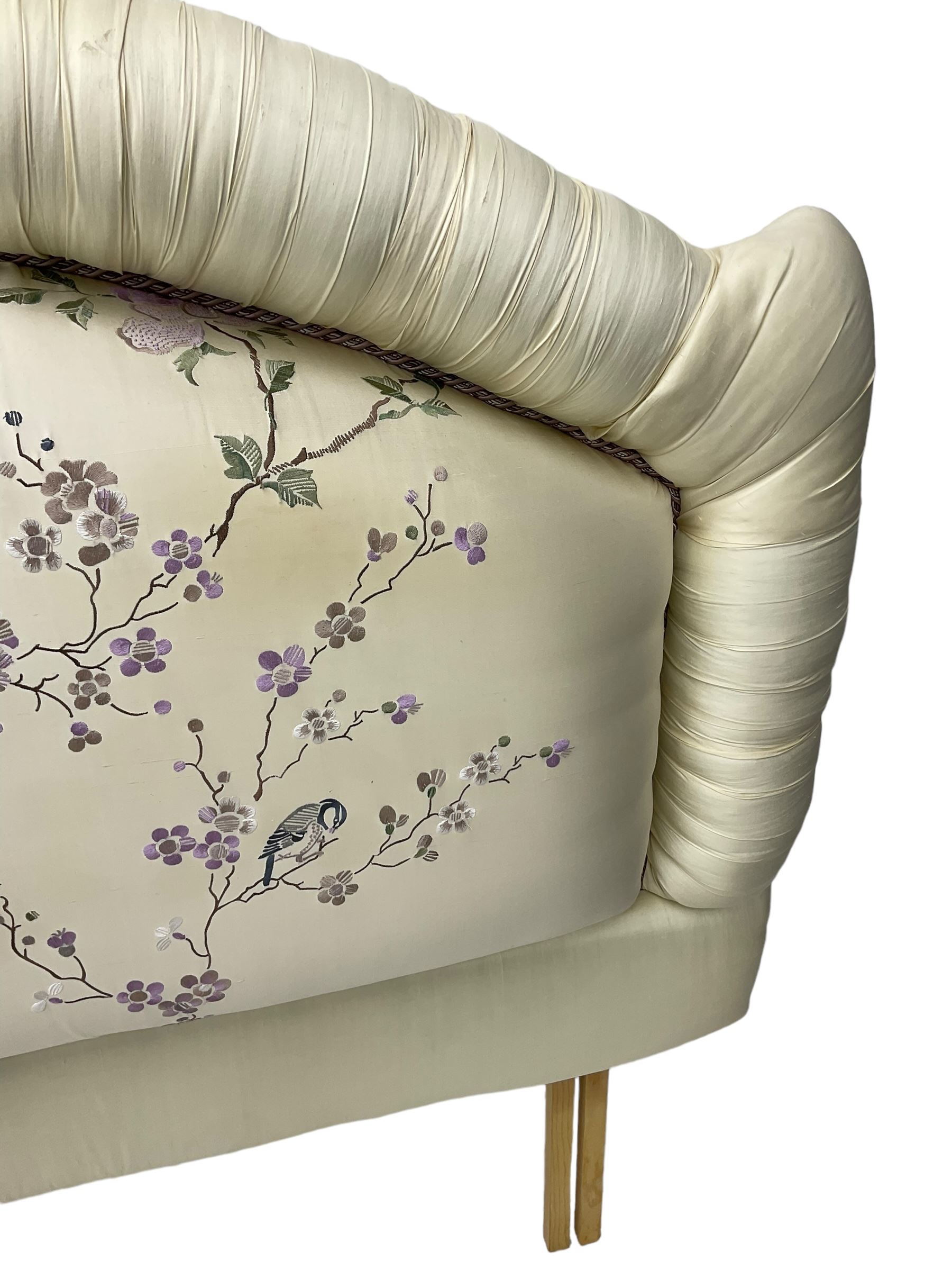 5' Kingsize headboard with stepped arch cresting, upholstered in cream silk with raised stitching decorated with trailing foliage branches and birds; matching bedspread (251cm x 218cm); two matching cushions  