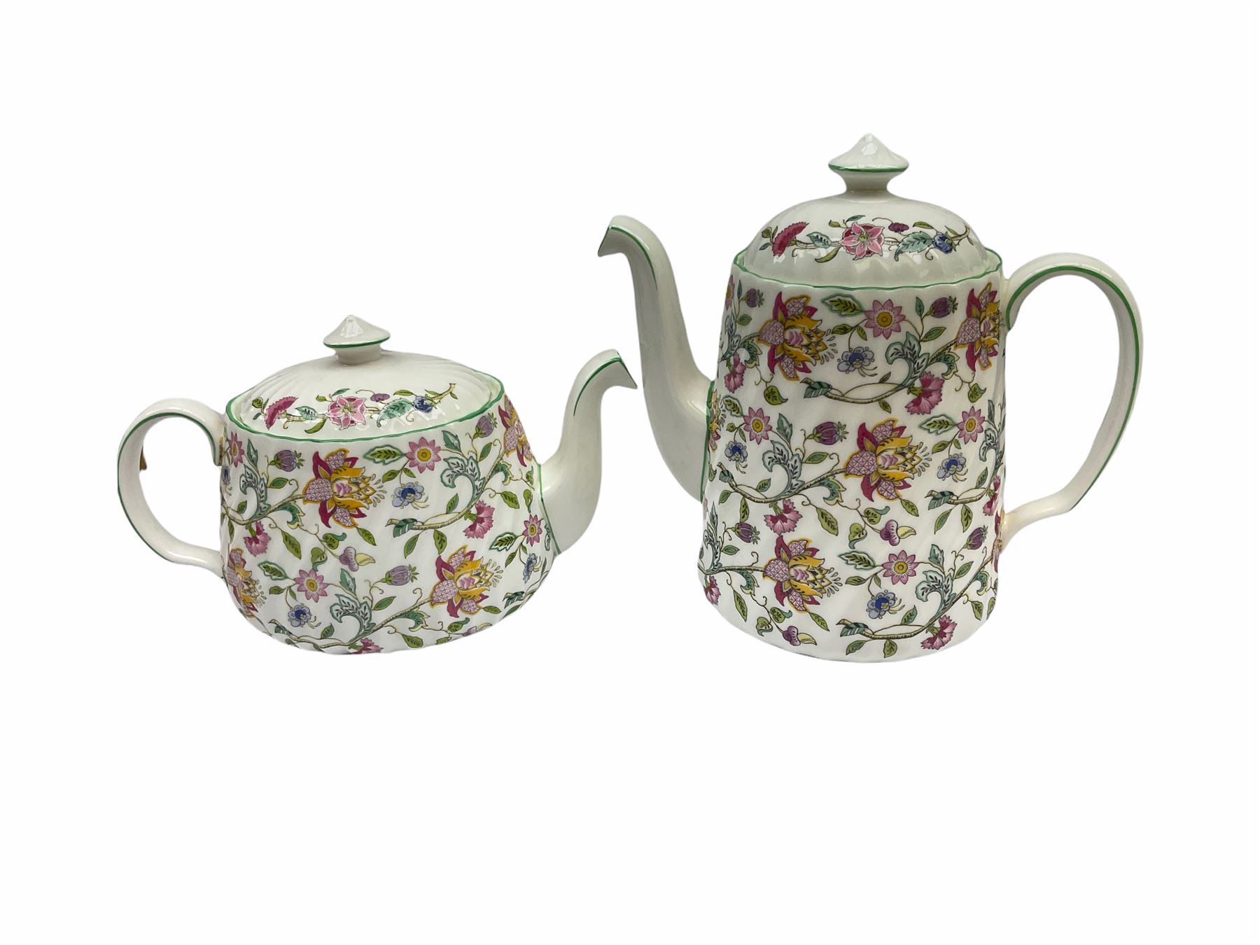 Minton Haddon Hall pattern tea and dinner wares, including basket dish, two covered tureens, six dinner plates, eight dessert plates, twelve tea plates, six soup bowls, six cereal bowls, teapot, coffee pot, milk jug, covered sucrier twelve tea cups and saucers, six mugs, footed bon bon dish, pair of candlestick holders, cake knife and slice etc (81)