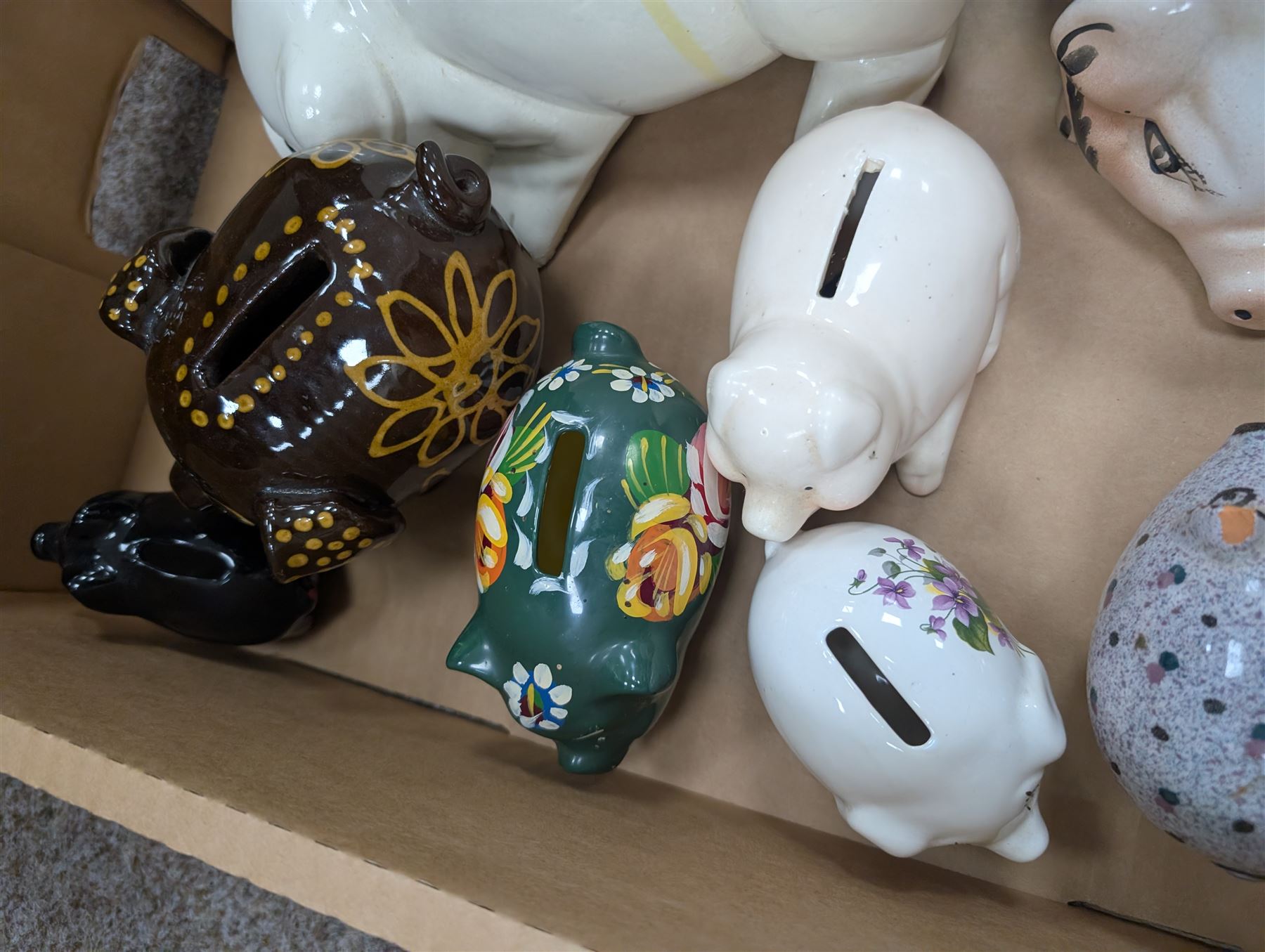 Collection of ten Vintage pottery piggy banks, to include treacle glaze example, H10.5cm, largest H18cm