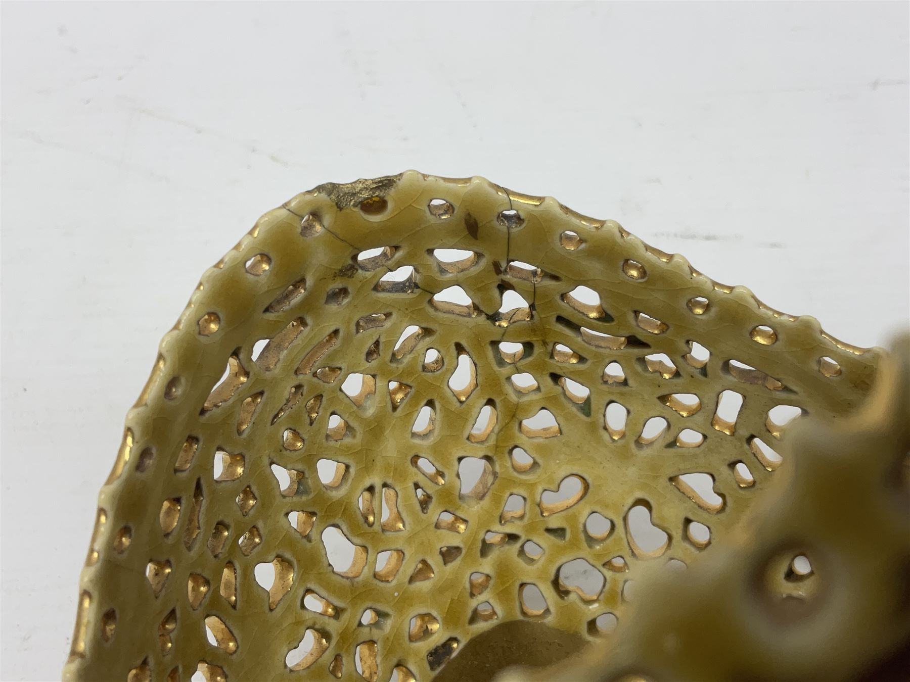 Hungarian Zsolnay Pecs gilt and green reticulated basket, upon four feet, with gold mark beneath, H14cm L21cm