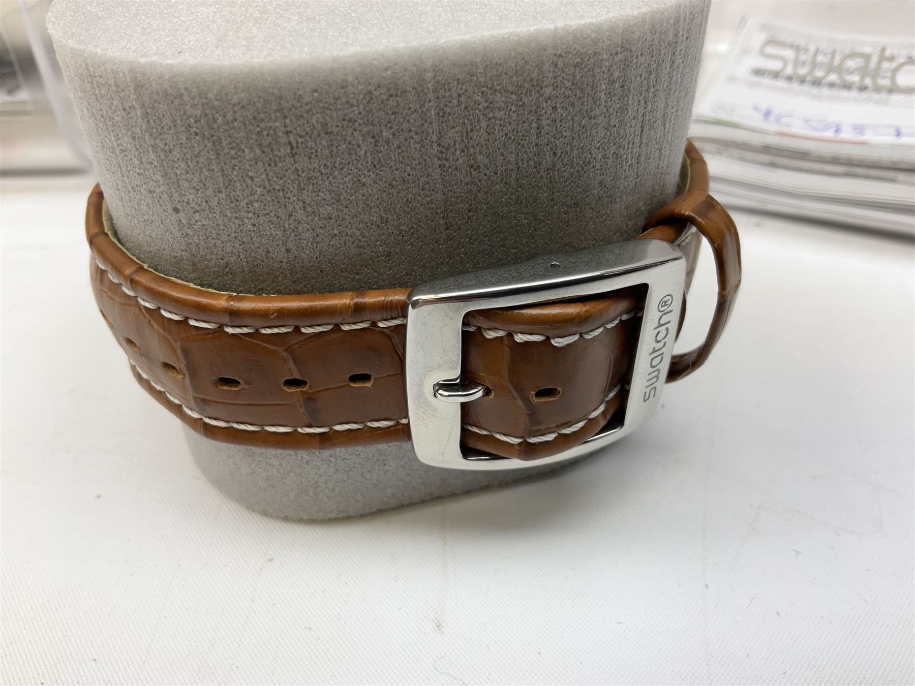 Swatch Irony chronograph stainless steel quartz wristwatch, on original tan leather strap and one other Irony quartz wristwatch, on stainless steel strap both boxed (2)