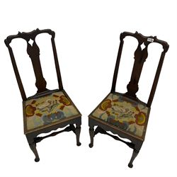 Pair of 18th century oak hall chairs, shaped crest and upper splats, upholstered drop in seats