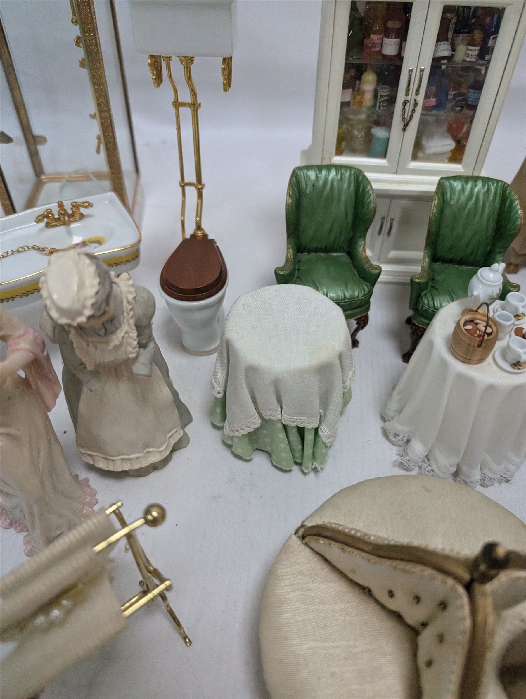 Dolls house bathroom and bedroom furniture, including bed, wardrobe, dresser filled with toiletries, shower, five figures, etc 