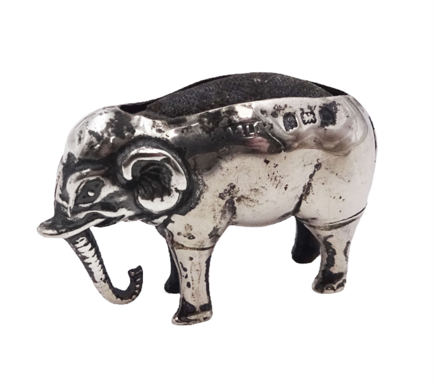 Edwardian silver mounted novelty pin cushion, in the form of an elephant, with cushioned back, hallmarked Birmingham 1906, maker's mark worn and indistinct, L4cm, H3.5cm