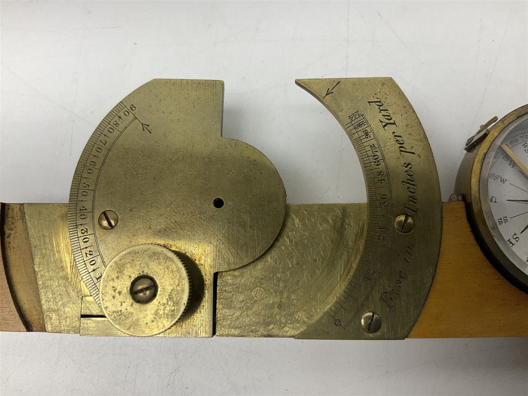 Late 19th/early 20th century boxwood and brass clinometer rule by Stanley, with inset magnetic compass, screw action protractor hinge divided to one degree with rise in inches per yard scale under, spirit level to one edge, marked 'W.F. Stanley Great Turnstile Holborn' with tables of distances, angles and thickness H16cm closed: in original leather covered case with instructions
