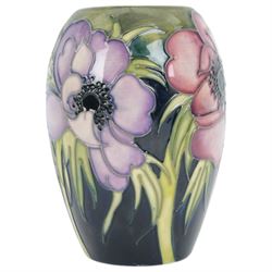 Moorcroft vase in Anemone pattern upon a dark blue ground, marked as a trial piece, impressed and painted marks to base, H14cm 