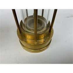 Four miners lamps, comprising Clanny miners lamp, with flip top and gauze protected by three rods, stamped E.T.W E-3, lamp with a gauze chamber protected by three rods, and two E. Thomas & Williams Ltd lamps, tallest example H26cm