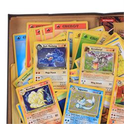 Collection of  Wizards Of The Coast Pokemon trading cards including Base Set, Jungle Set, Fossil Set and Team Rocket examples, black star promo Mew, Arcanine and Pikachu, holo Ninetales and Clefairy, 1st edition pre-release holo Aerodactyl, Team Rocket Dark Machamp holo and Jungle set Flareon, Vaporeon and Scyther holos 