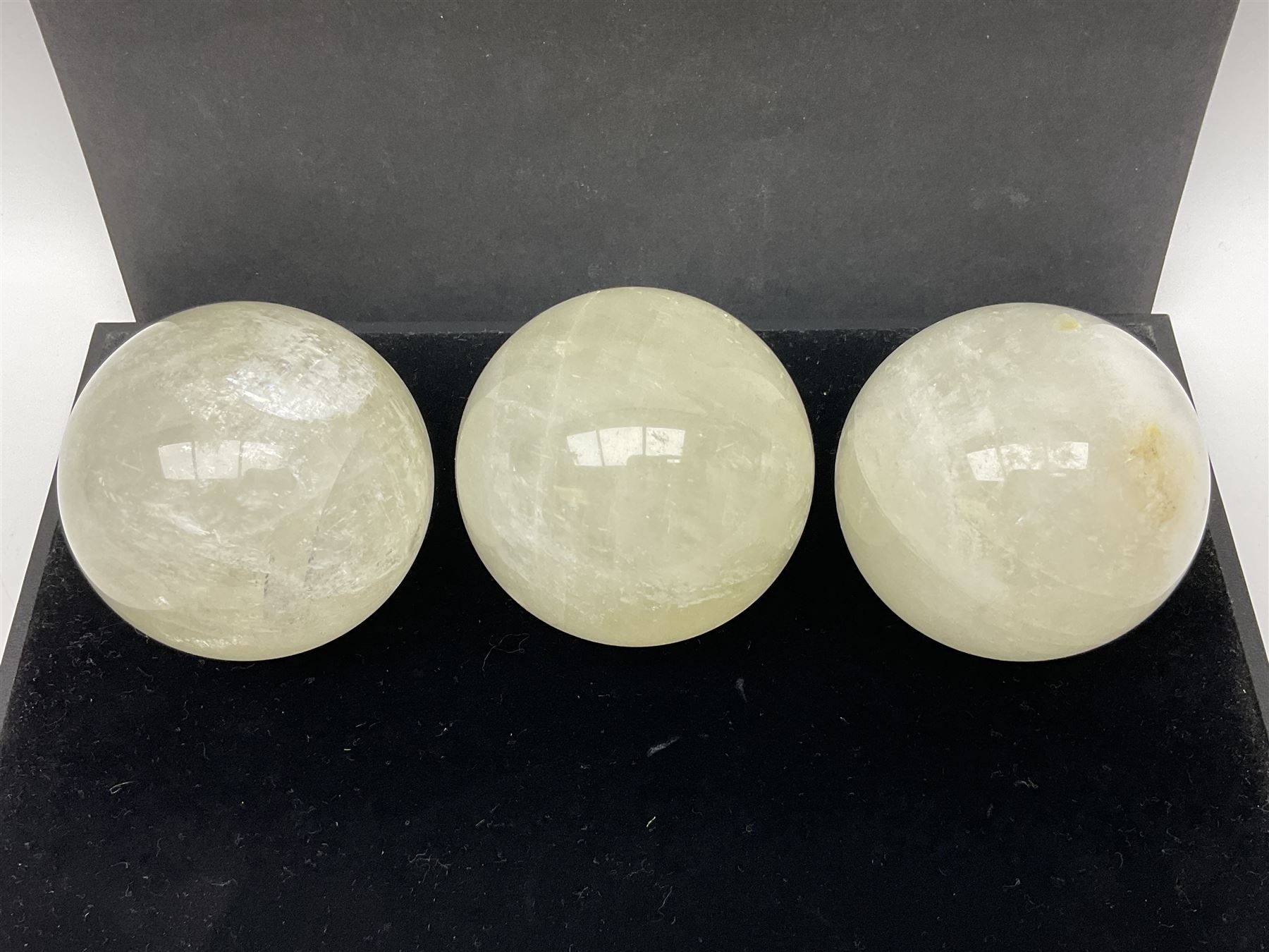 Set of three clear calcite spheres, D8cm