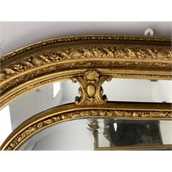 Gilt Rococo style mirror, arched top with central cartouche and oak leaf moulded pediment, floral and fruit moulded surround with segmented glass panels, bevelled central pane, c-scroll shell and acanthus leaf brackets