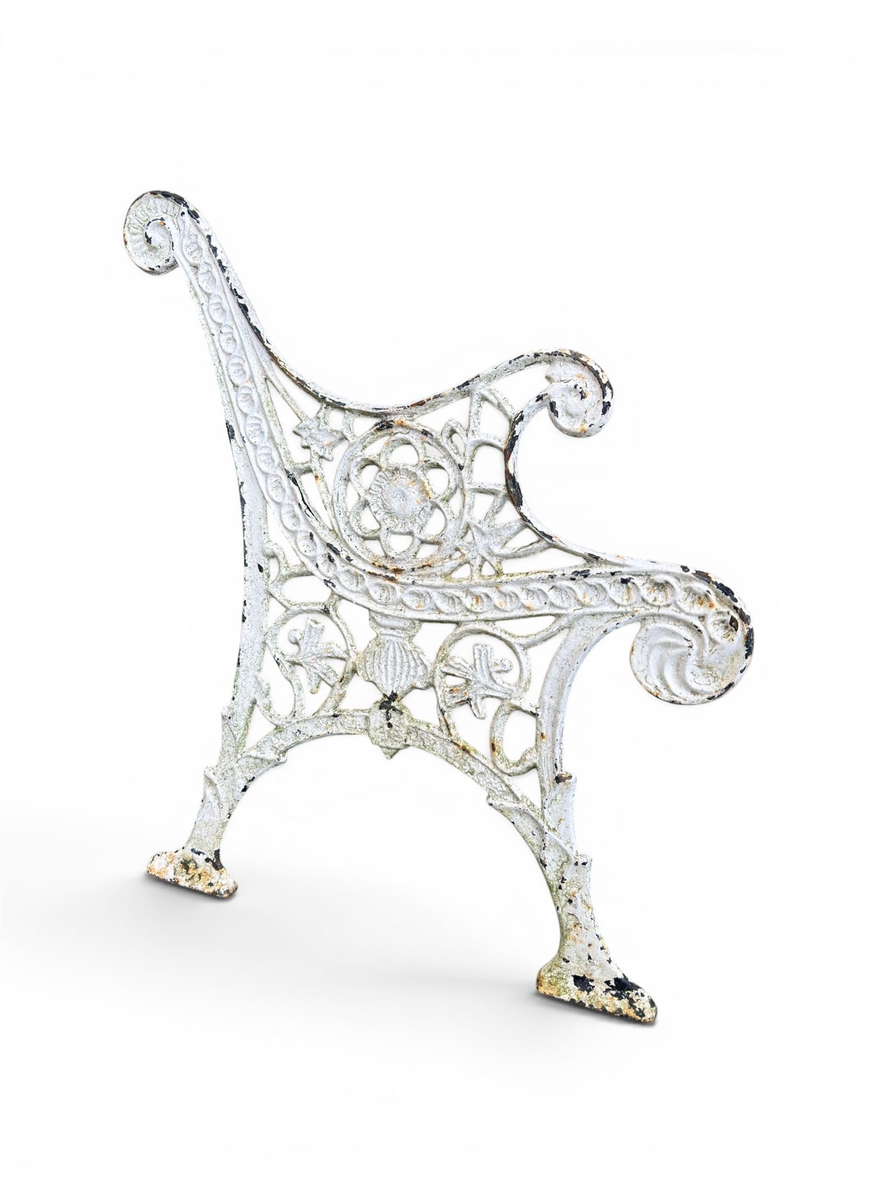 Pair of ornate painted cast iron bench ends, painted in white finish