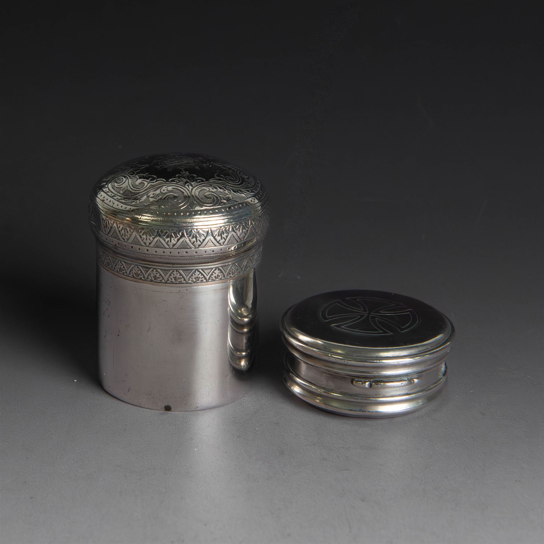 Late Victorian silver jar with cover, of cylindrical form with  domed cover engraved with initials, hallmarked Charles & George Asprey, together with a small ecclesiastical trinket box, engraved with cross to cover and with personal engraving beneath, hallmarked Edgar Ernest Davis, London 1944, taller jar H6cm