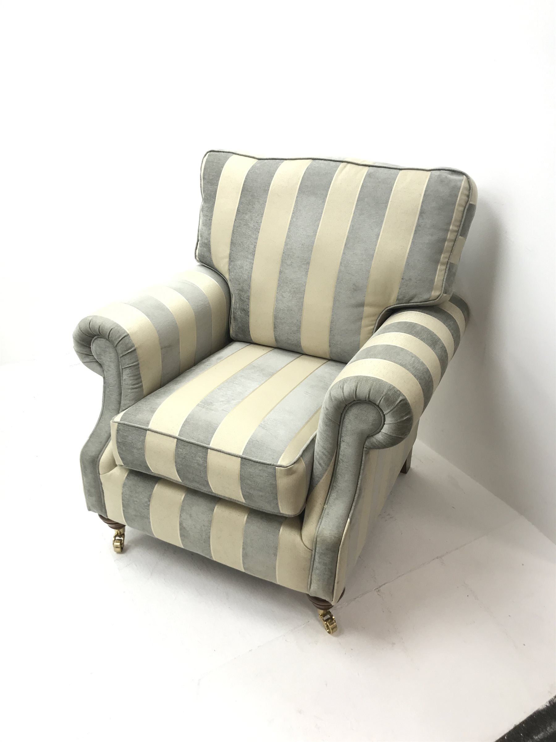 Alstons two seat Amberley sofa upholstered in grey and pale gold stripes, turned supports on castors (W195cm) and two matching armchairs (W92cm)