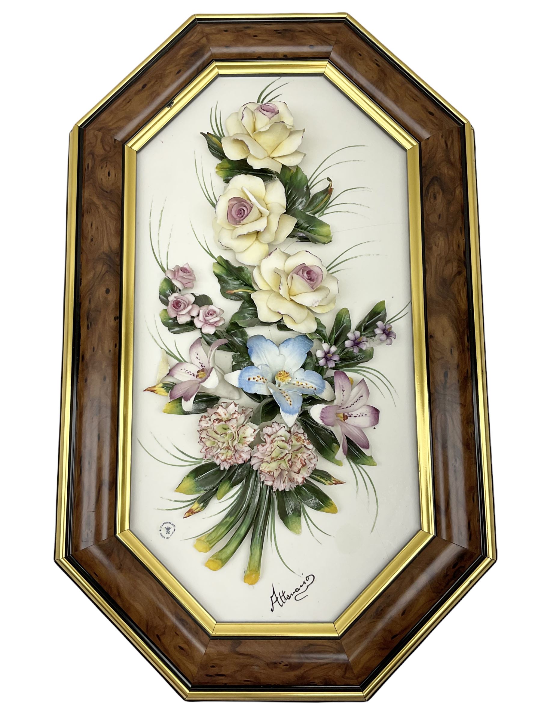 Set of three Capodimonte wall plaques, depicting floral decoration in octagonal frames with gilt edging, largest plaque H48, two small plaques H31cm.    