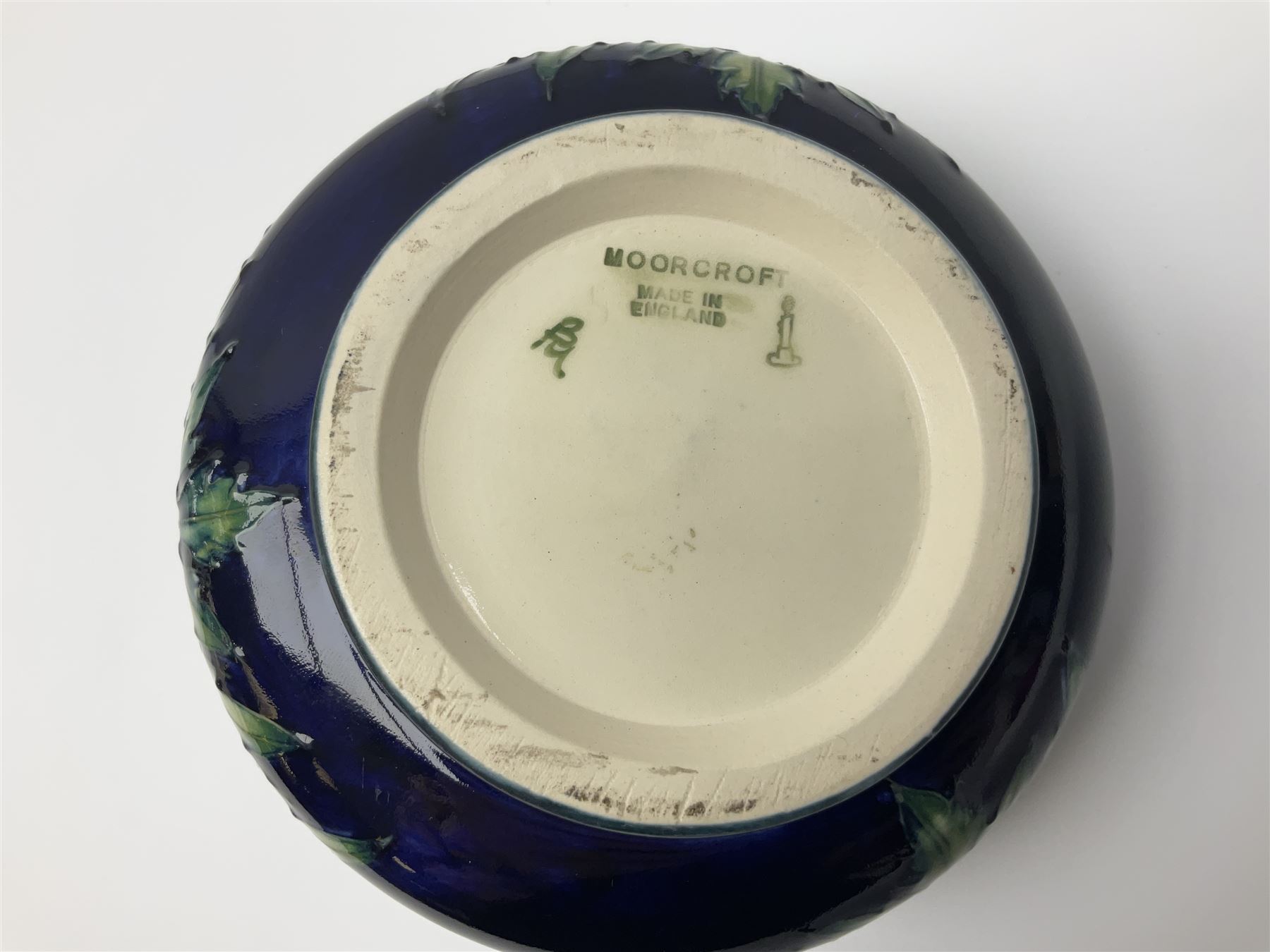 Moorcroft dish and cover, of circular form, decorated in Buttercup pattern, together with a Moorcroft vase, of baluster form, decorated in Magnolia pattern, both with printed marks beneath, tallest H9.5cm