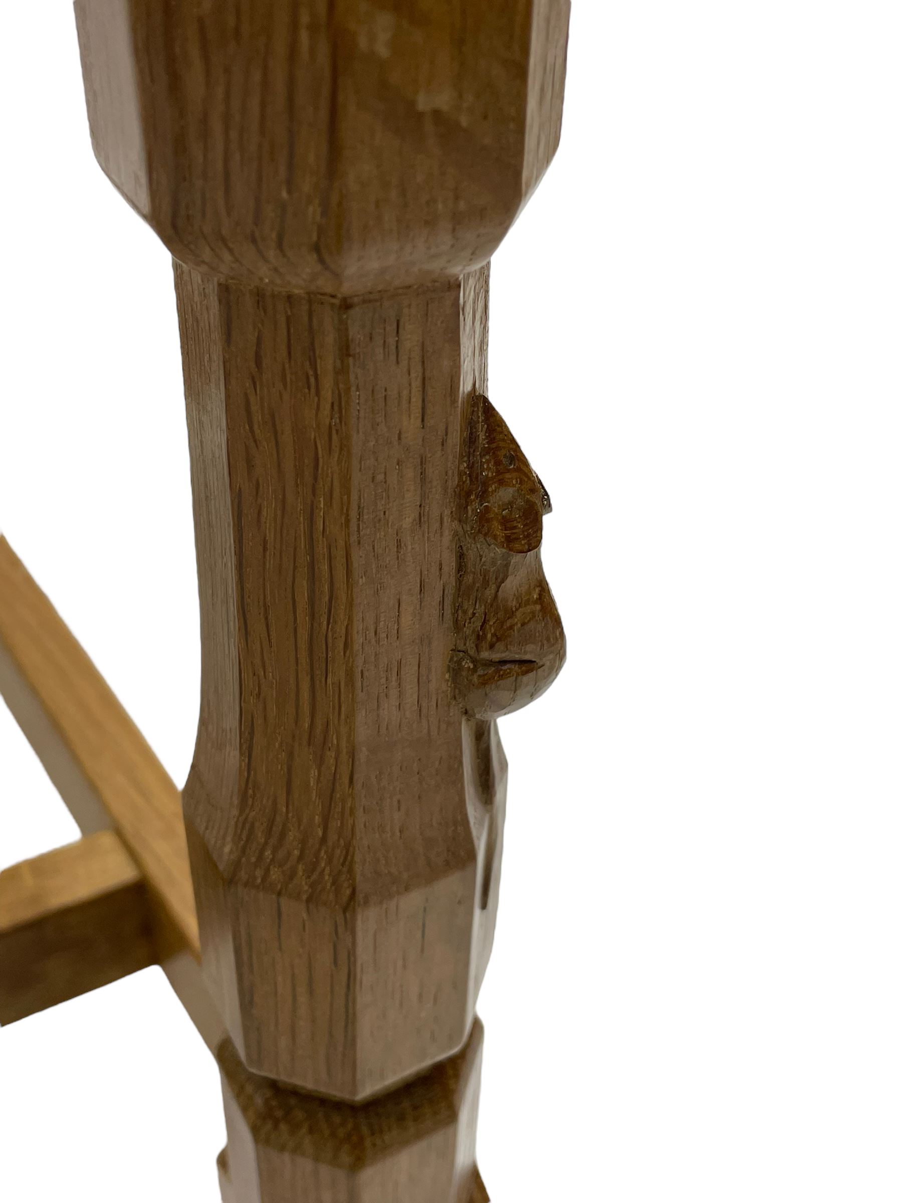 Mouseman - oak carver elbow chair, pierced and carved lattice back over leather upholstered seat with stud band, on octagonal supports united by plain stretchers, carved with mouse signature, by the workshop of Robert Thompson, Kilburn 