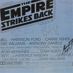 Autographed 1980s Star Wars Empire Strikes Back movie poster, with artwork by Tom Jung, with signatures including Michael Sheard (Admiral Ozzel), Koo Stark, Caroline Blakiston (Mon Mothma), Shelagh Fraser (Aunt Beru), Mike Edmonds (Logray), Peter Mayhew (Chewbacca), Jeremy Bulloch (Boba Fett), Stuart Freeborn (Creature Designer), Warwick Davies (Wicket), Michael Carter (Bib Fortuna), Dave Prowse (Darth Vader), Kenny Baker (R2D2), signatures and poster obtained at the Dave Prowse Promotions Mulitcon Event 1998 at The Norbreck Caste Hotel, Blackpool, in glazed black frame, frame H115cm
