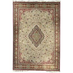 Persian design red ground rug, the central shaped medallion with floral palmette decoration, within an ivory field of scrolling Boteh motifs, guarded border with repeating stylised flower heads