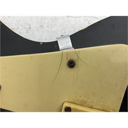 Stagg heavy metal style six-string electric guitar, finished in black with chrome tuning pegs, fret markers and humbucker pickups to bridge L106cm; and Hondo USA electric guitar with black body, ivory coloured pickguard and mother-of-pearl fretmarkers L101cm (2)   