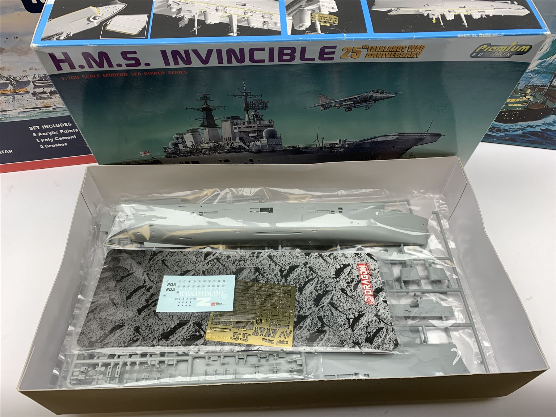 Ten plastic model kits of ships by Airfix, Revell, Dragon and Skywave, predominantly 1/600th scale including R.M.S. Titanic, HMS Invincible, two x HMS Ark Royal, HMS Fearless, HMS Hood, HMS Belfast, Bismarck etc; all boxed, most in factory sealed transparent packaging (10)