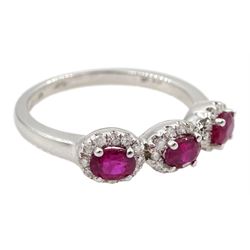 White gold three stone oval ruby and round brilliant cut diamond cluster ring, hallmarked