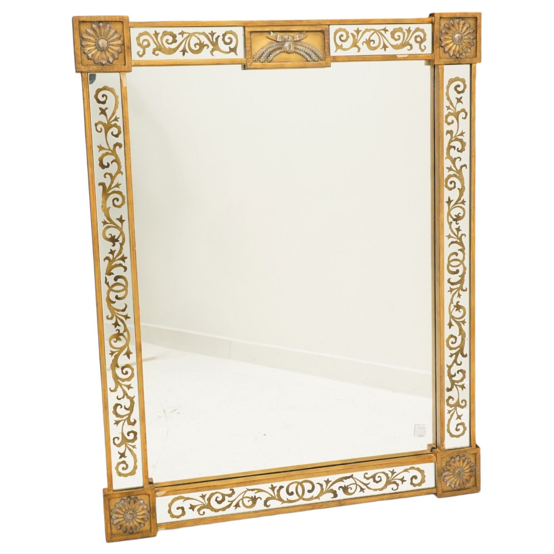 Regency inspired overmantel mirror, decorated with gilt foliate scrolls on the mirrored surrounds, flower and swag applied mounts