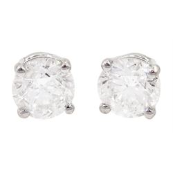 Pair of 18ct white gold round brilliant cut diamond stud earrings, total diamond weight 1.57 carat, with World Gemological Institute report