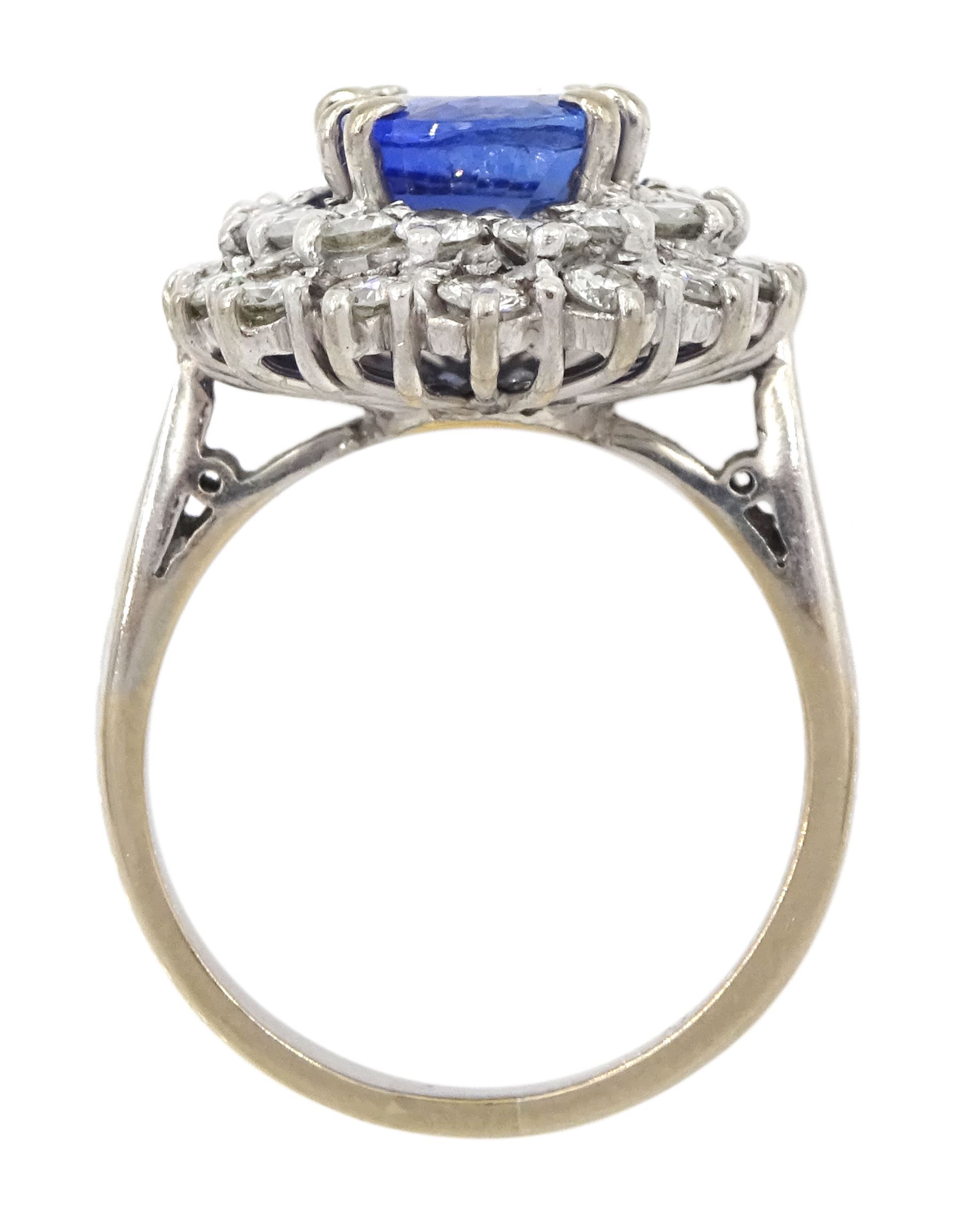 18ct white gold oval sapphire and round brilliant cut diamond cluster ring, Sheffield 2000, sapphire approx 3.75 carat, total diamond weight approx 0.70 carat
