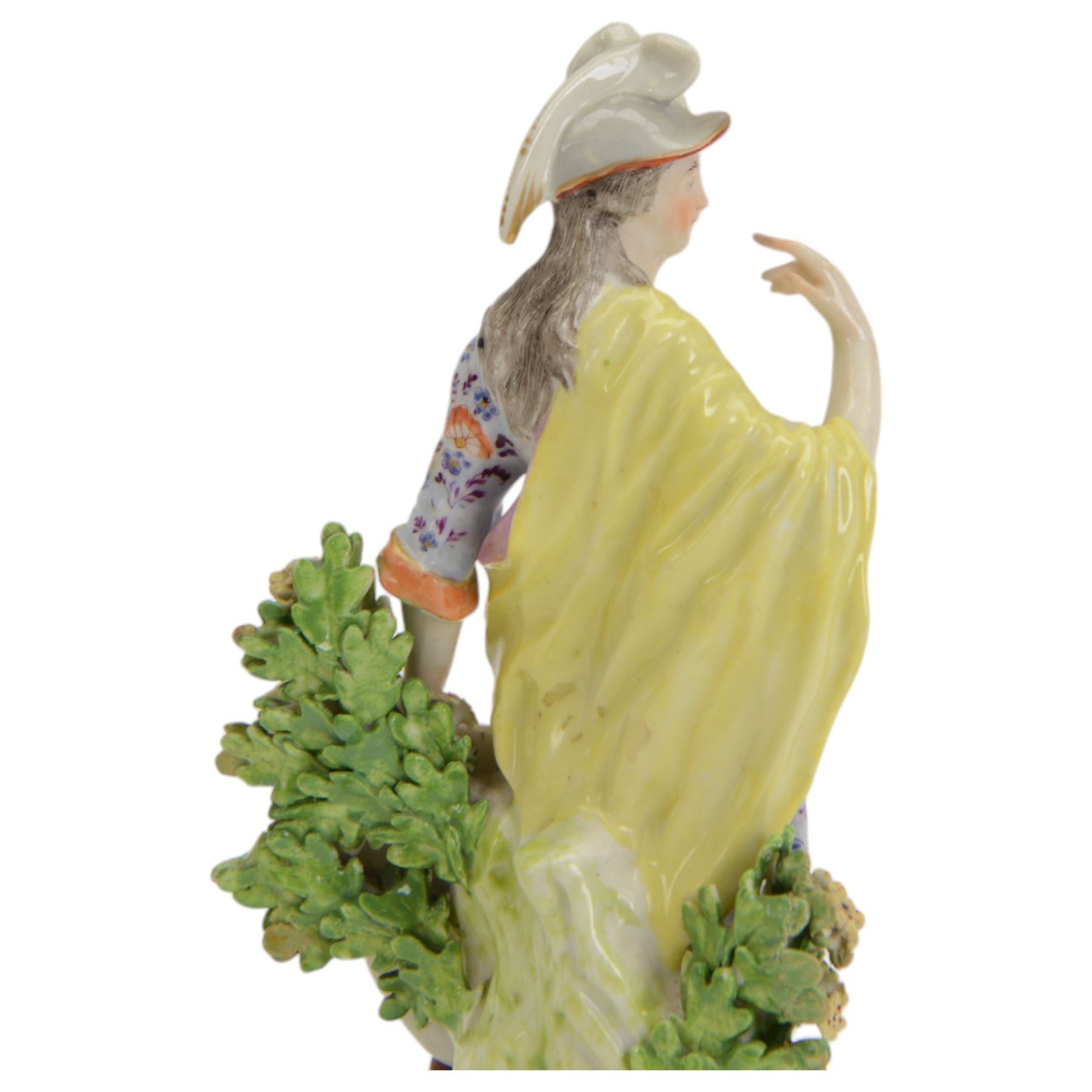 18th century Derby porcelain figure, circa 1775, modelled as Minerva, standing with mask shield, books and owl, against flowering bocage, upon a scroll base encrusted with flowers, H23cm