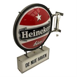 Heineken Bier Advertising sign - circular convex backlit logo, on cast metal bracket, with 'De Nije Haven' text below