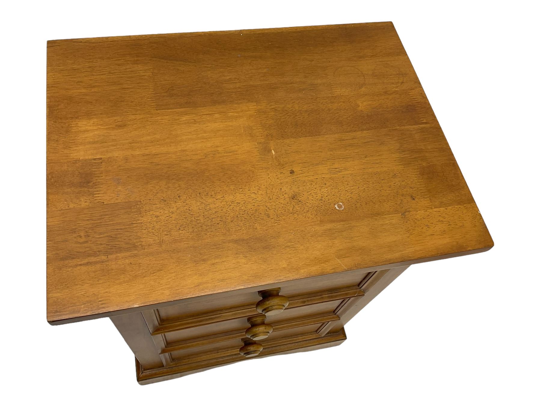 Pair of contemporary cherry wood bedside chests, rectangular top and projecting moulded cornice over three drawers, on plinth base with shaped apron