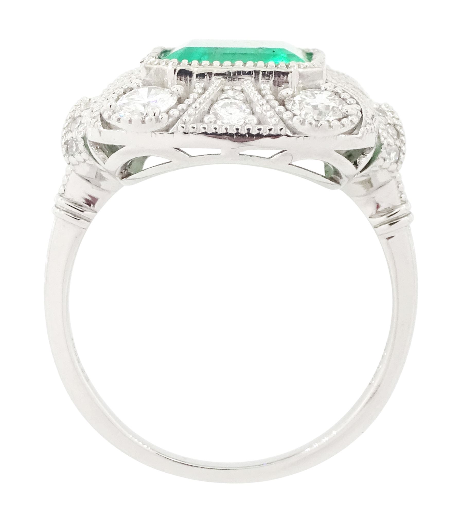 Platinum emerald and diamond cluster ring, single octagonal cut emerald of 2.52 carat, surrounded by milgrain set round brilliant cut and single cut diamonds, stamped PT950, total diamond weight 0.82 carat