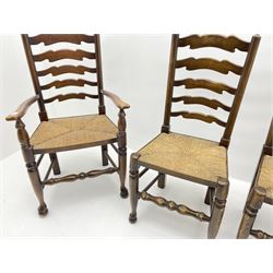 Set four (2+2) late 20th century stained ash farmhouse style dining chairs, with waved ladder backs and rush seats