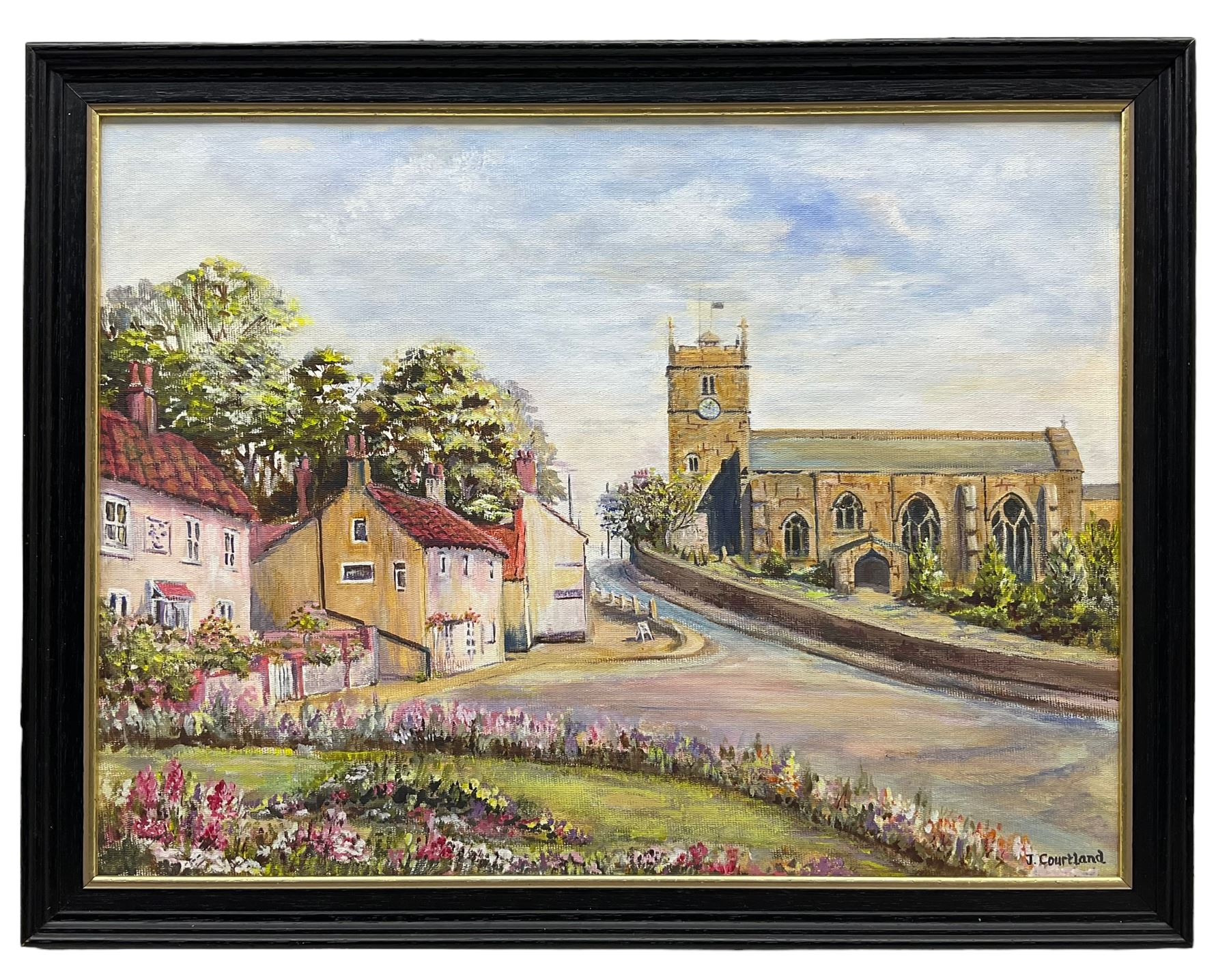 J Courtland (British 20th century): 'Hunmanby Village' near Filey, oil on canvas board signed, titled verso 30cm x 40cm
