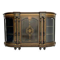 Victorian ebonised and inlaid credenza, break-front with curved ends, the front fitted with two curved glazed doors and central panelled door, inlaid with scrolling foliate and star motifs, quadruple turned and fluted pilasters to front, gilt egg and dart moulded edge on plinth base with figured walnut band, on turned feet