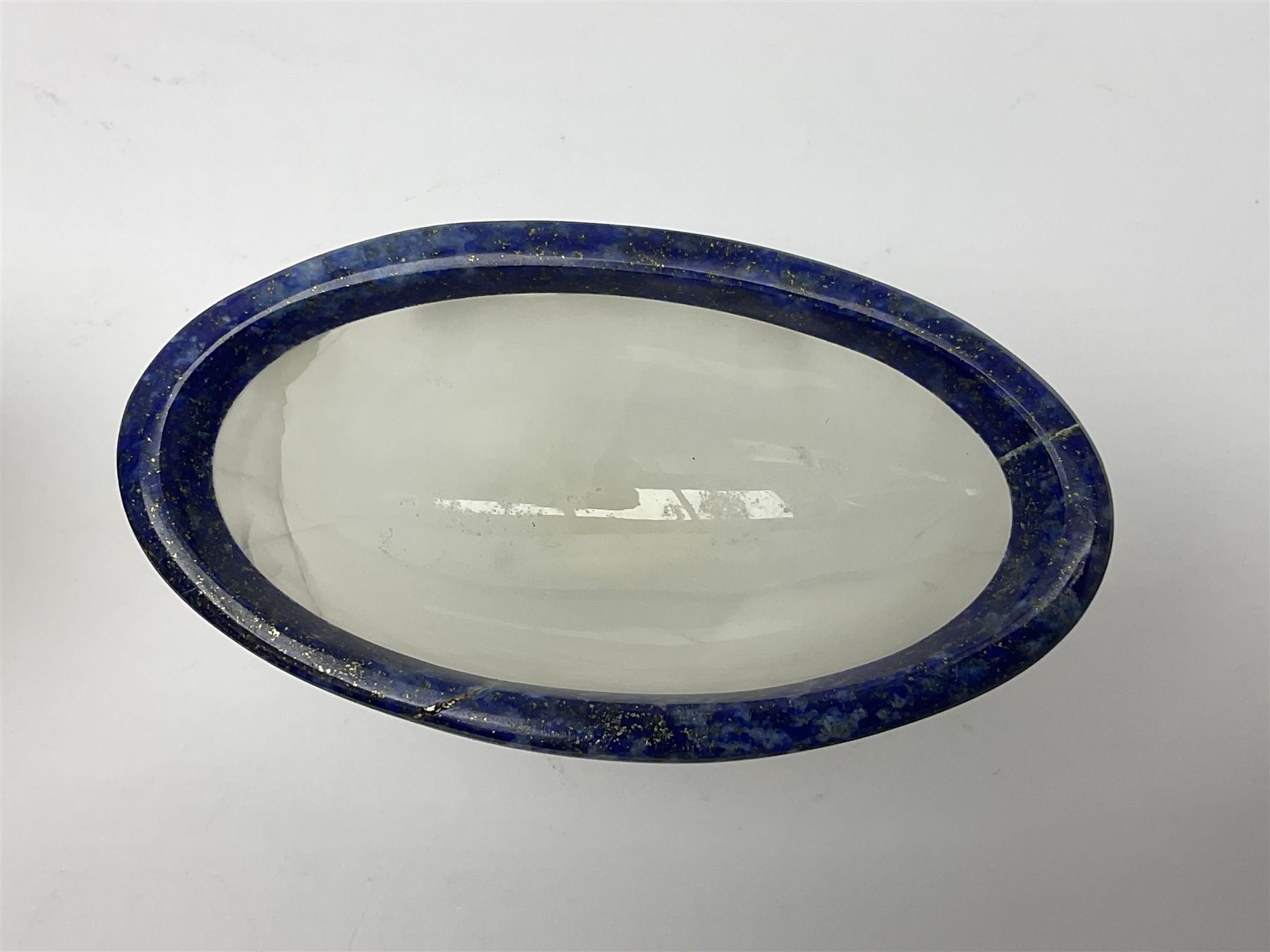 Pair of lapis lazuli and agate open salts, of navette form, upon a stepped oval pedestal foot, H5cm, L8cm