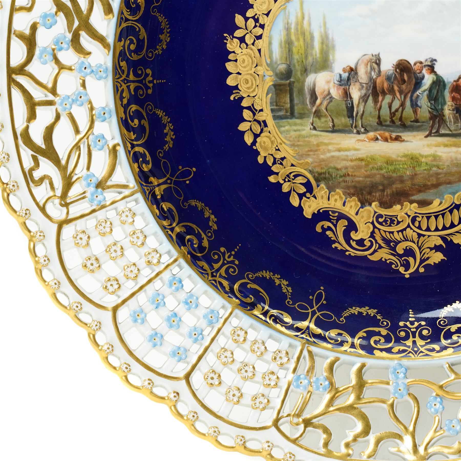 19th century Meissen cabinet plate, the reticulated border modelled with trellis panels and forget-me-nots,  the cobalt blue well with gilt bordered central reserve painted with a scene of a hunting party resting after Philips Wouwerman (Dutch 1619-1668), underglaze blue crossed swords and indistinct impressed numbers verso, D26cm