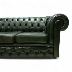 Late 20th century chesterfield style sofa upholstered in green leather, with deep buttoned back and arms above three loose cushions, continuous scroll arms and front, on concealed block feet