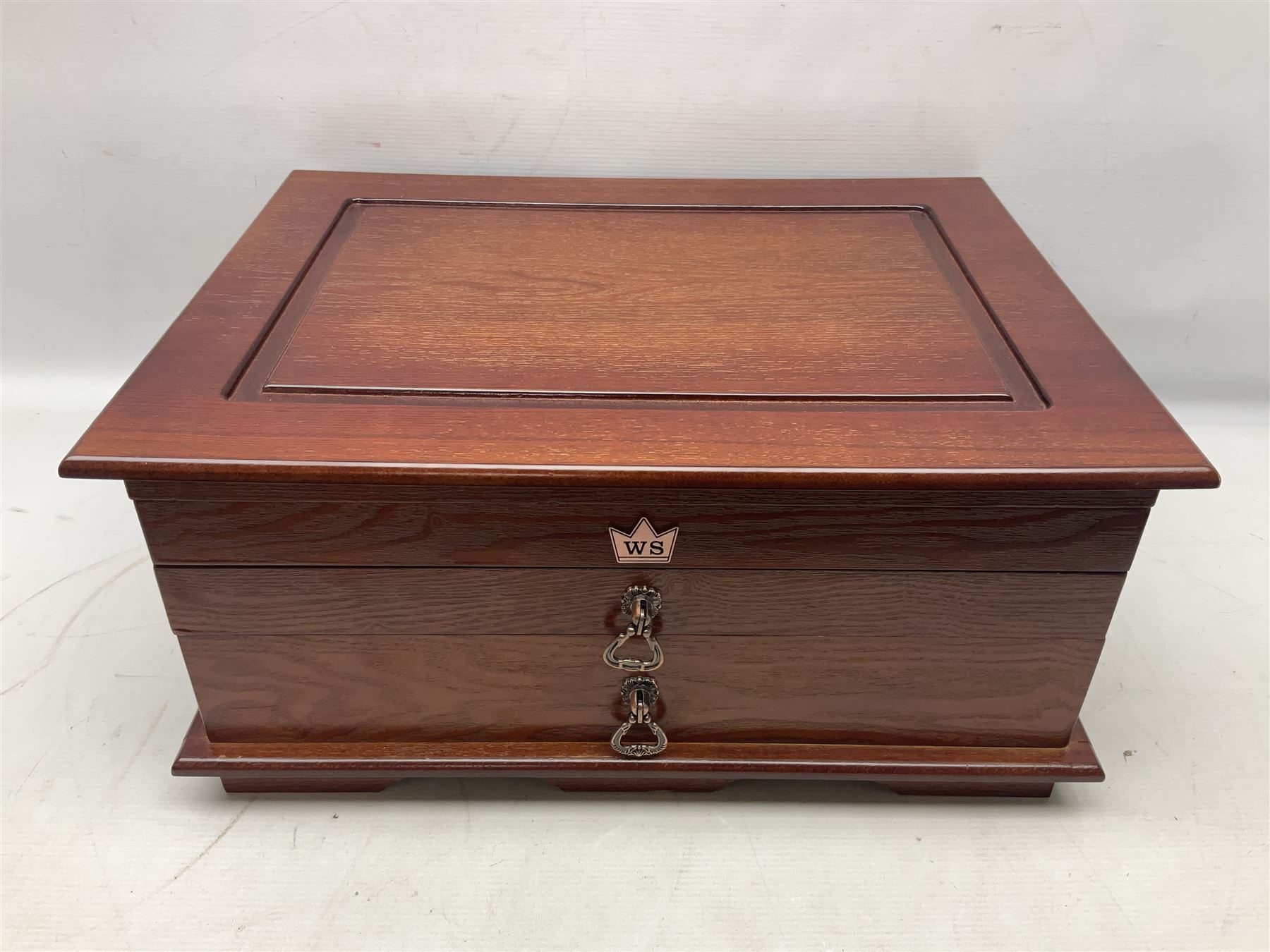 Waltmann und Sohn part canteen of stainless steel and gilt cutlery, the stained wood case with hinged lid above two fitted drawers, L48cm