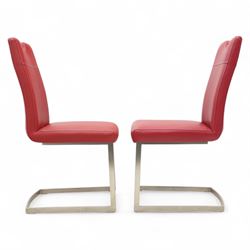 Set of seven contemporary style dining chairs, each with a high padded back and seat upholstered in faux leather on brushed steel sled bases  