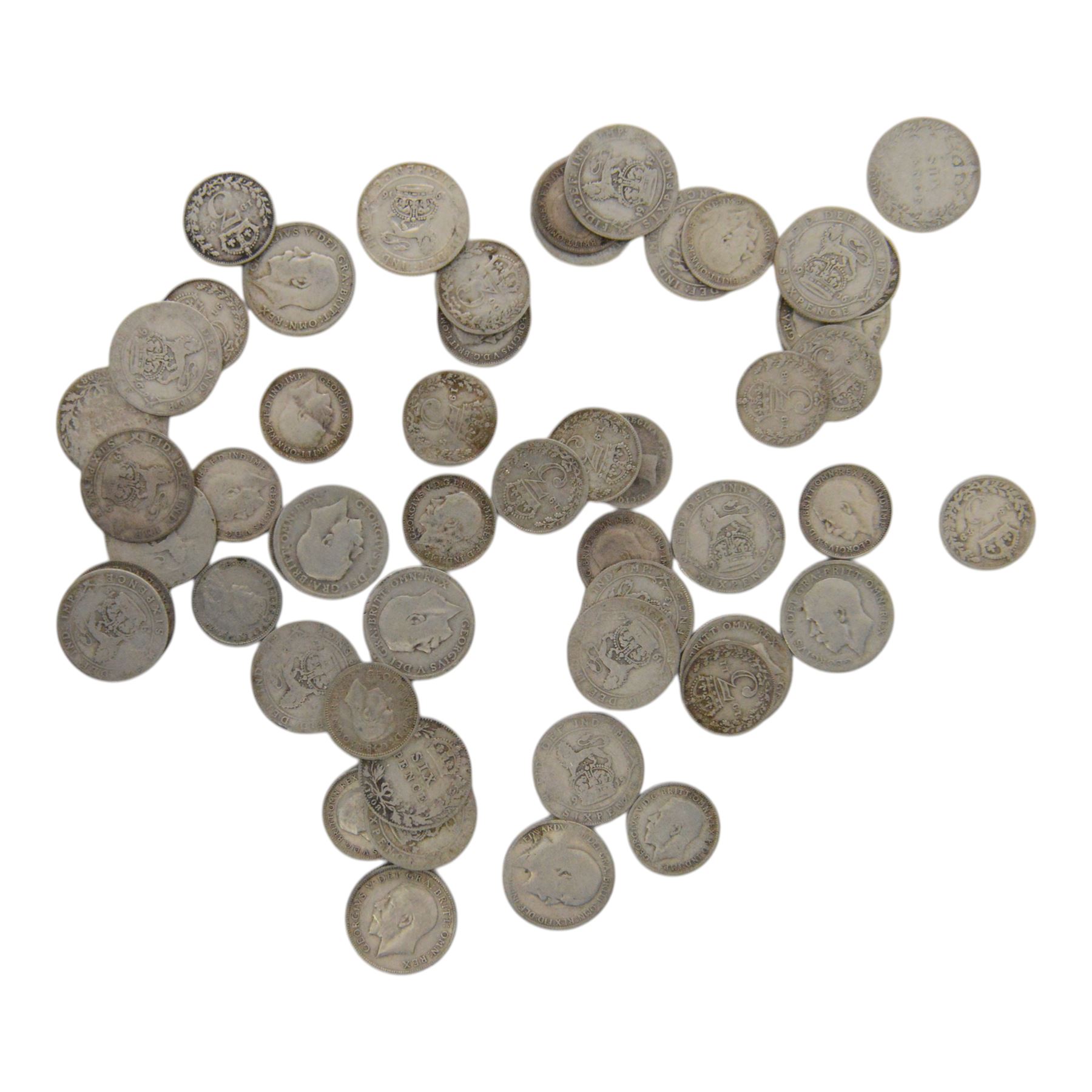 Approximately 108 grams of Great British pre-1920 silver sixpence and threepence coins, and approximately 29 grams of Great British pre-1947 silver threepence coins
