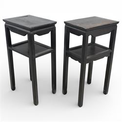 Near pair of 19th century Chinese hardwood stands, each with rectangular tops above plain friezes, open undershelves, square section legs joined by stretchers, black lacquered finish