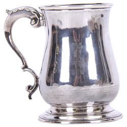 George III silver mug, of bellied form with acanthus capped scroll handle, upon a circular stepped foot, hallmarked Fuller White, London 1764, H12cm