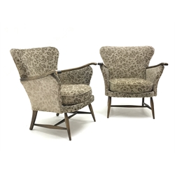  Pair Parker Knoll armchairs, upholstered in a patterned beige fabric, turned supports joined by stretchers, W79cm  