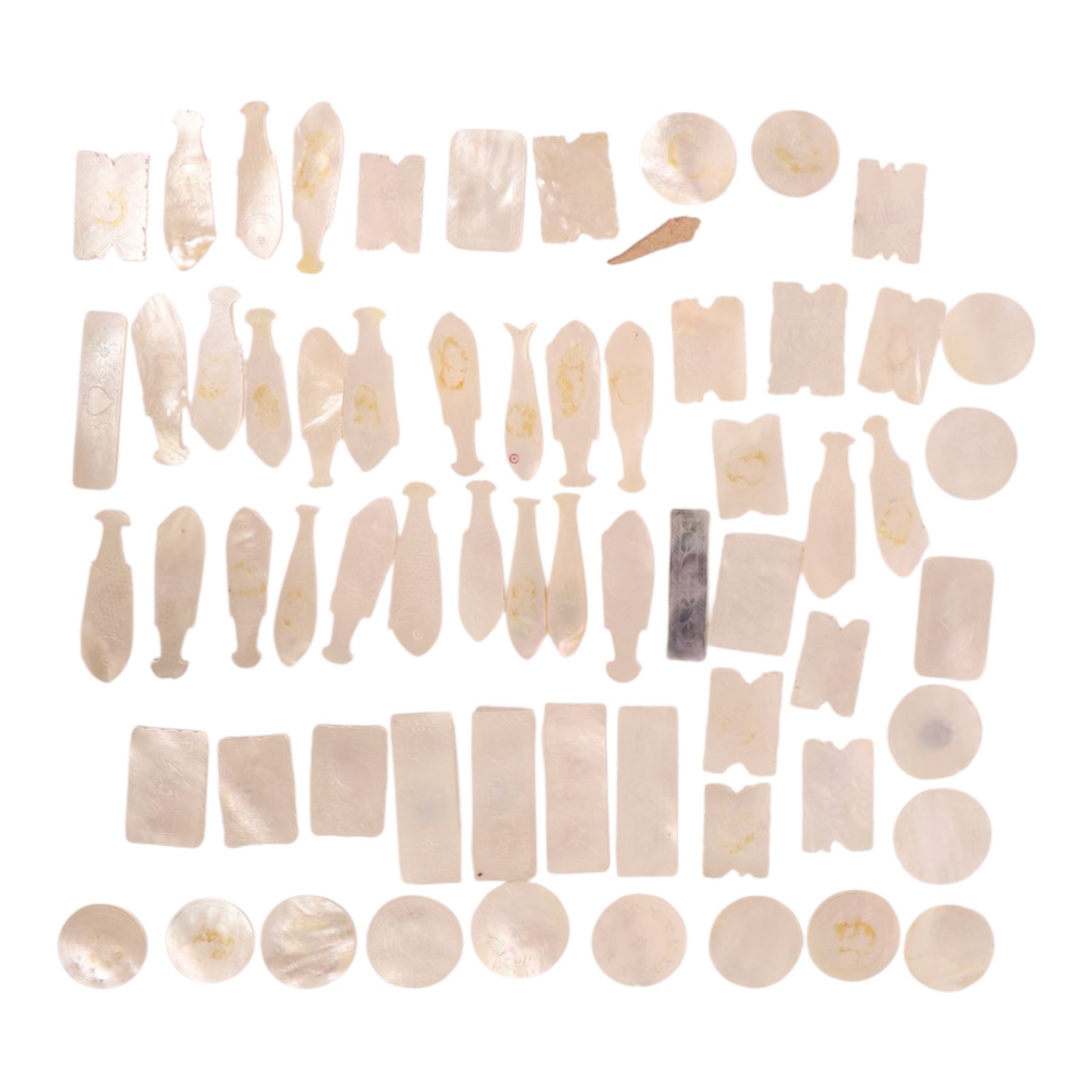 Collection of approximately sixty mother-of-pearl gaming tokens, including fish-shaped, rectangular, circular examples 