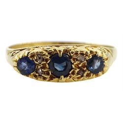 18ct gold three stone sapphire ring, with diamond accents set between