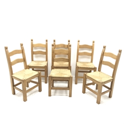 Solid pine table, turned tapering reeded supports (W153cm, H79cm, D91cm) and set five beech ladder back dining chairs, rush seat, square supports (W48cm)