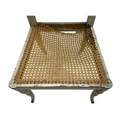 Collection of Regency dining chairs - set of four Regency painted beech dining chairs, with cane seat and back, on collar turned supports with splayed feet (W46cm, H84cm); a pair of Regency ebonised dining chairs (W47cm, H77cm); and a single Regency dining chair, the cresting rail painted with floral cornucopias and central putto vignette, X-frame back over cane seat, on collar turned front supports painted with foliage (W46cm, H84cm) (7)