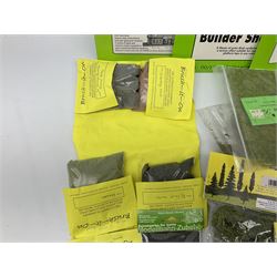 Quantity of unused and unopened layout accessories Green Scene Foliage Matting, Brush-It-On Ballasting, K & M (Peco) Trees, Busch Cornfield Sheets,  Metcalfe Paving/Cobblestones, Tarmacadam and N-Gauge Buildings Sheets etc; together with ten Gilco die-cast road signs
