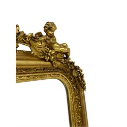 Victorian design gilt overmantel mirror, central cartouche pediment with extending leafy branches decorated with flower heads held by winged putto,  moulded frame decorated with repeating foliate patterns, scrolled acanthus leaf lower brackets, bevelled mirror plate